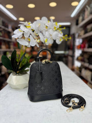 lv alma handbag and backpack