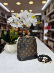 lv alma handbag and backpack