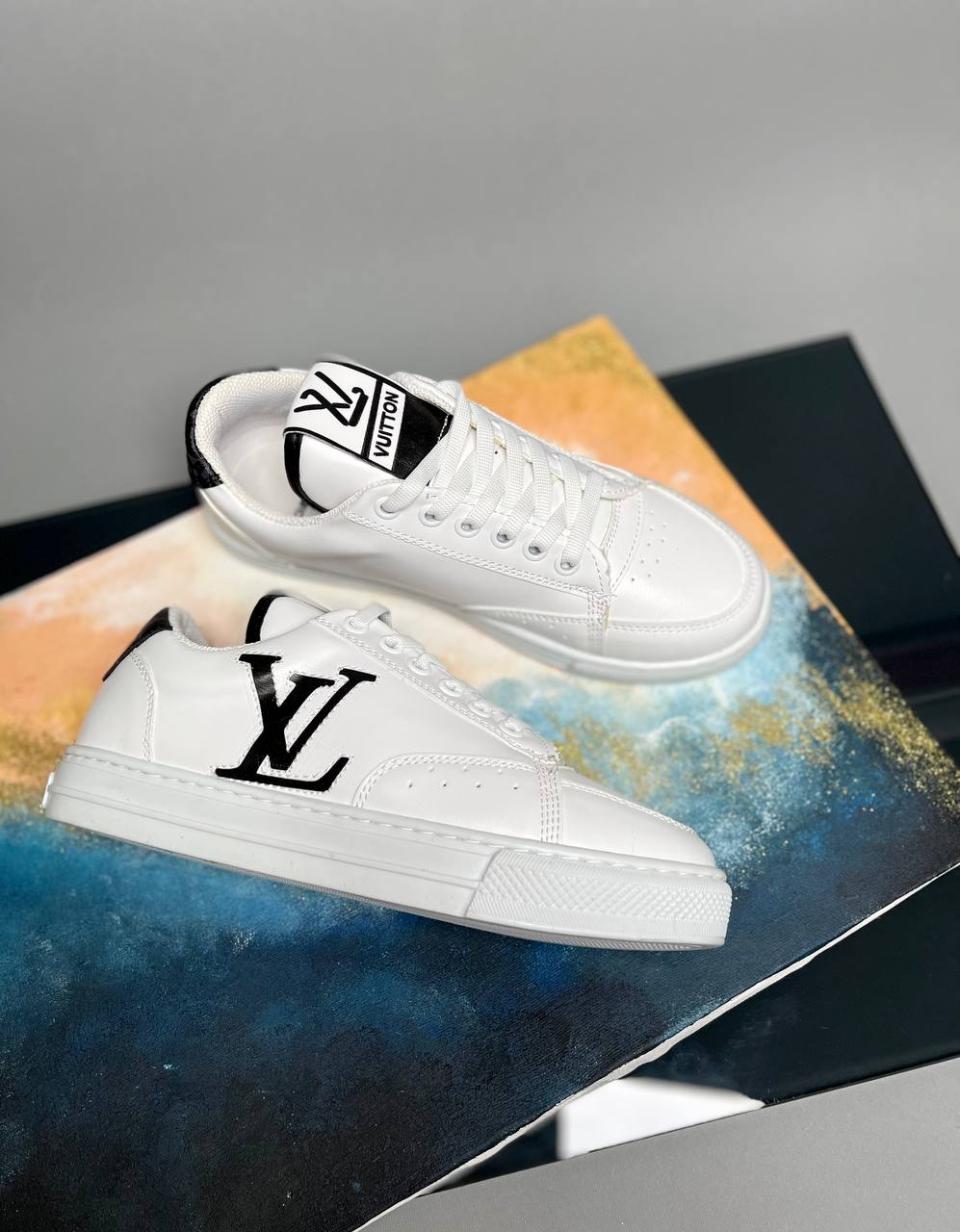 Sneakers with LV writing on your side