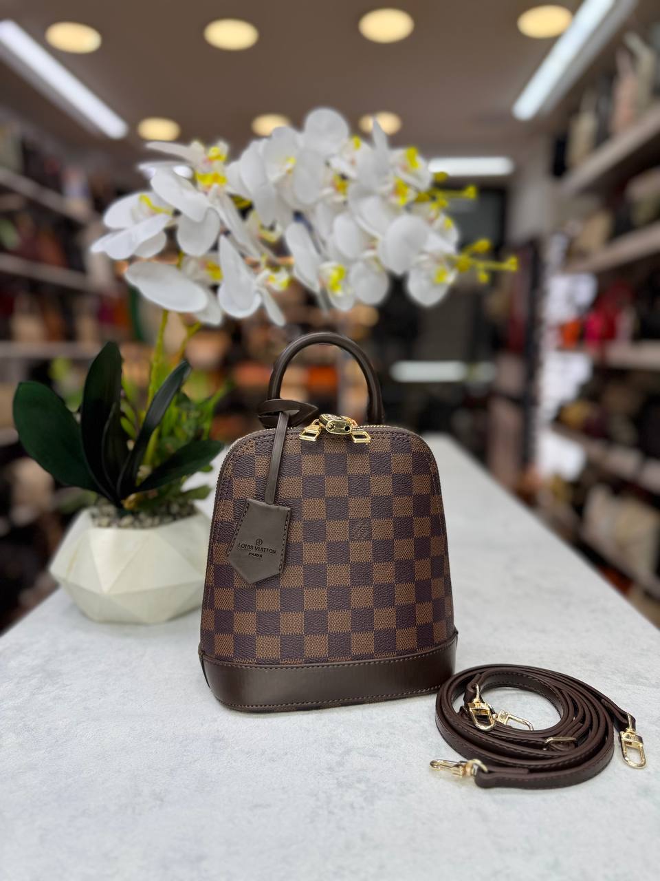 lv alma handbag and backpack