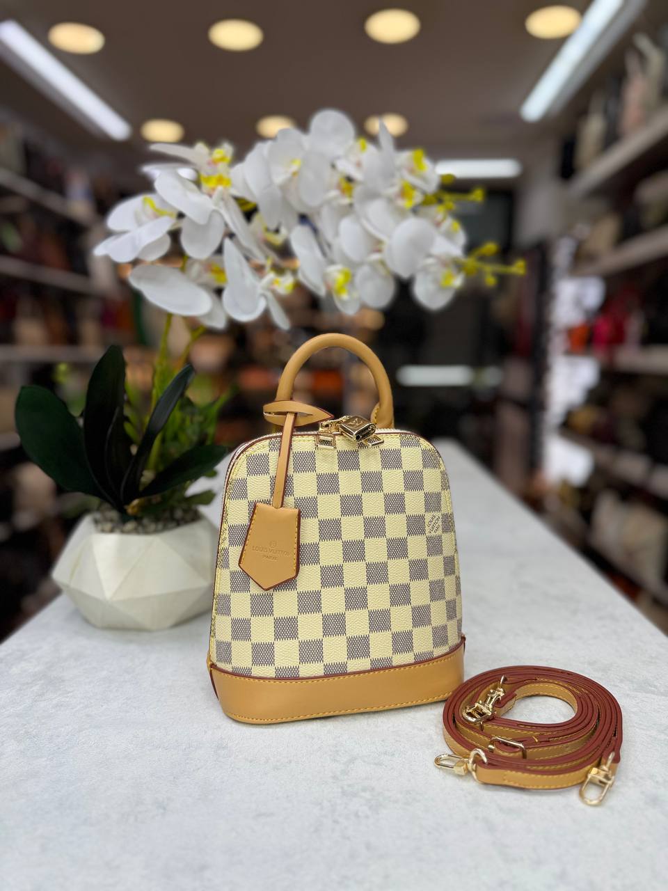 lv alma handbag and backpack