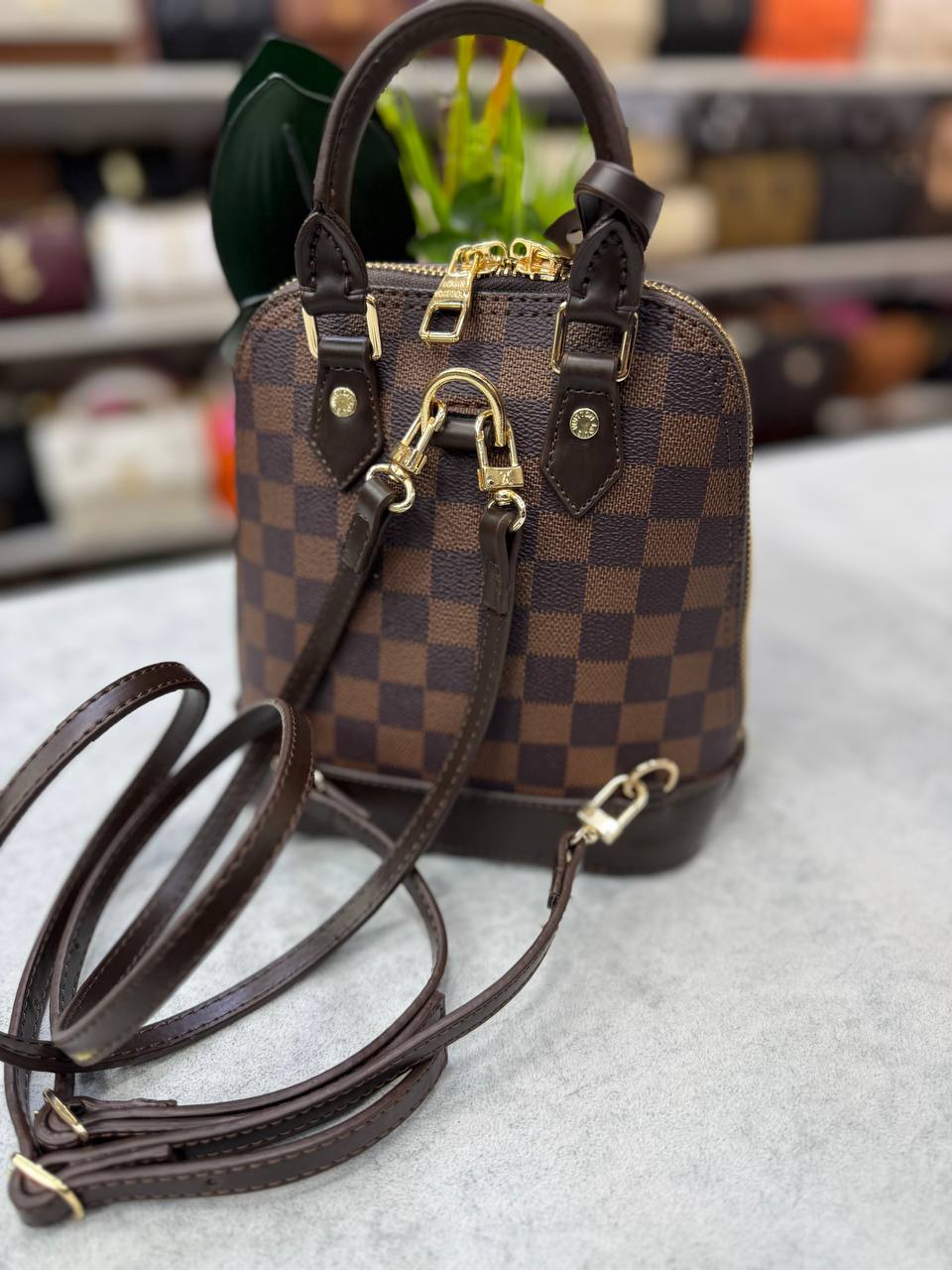lv alma handbag and backpack