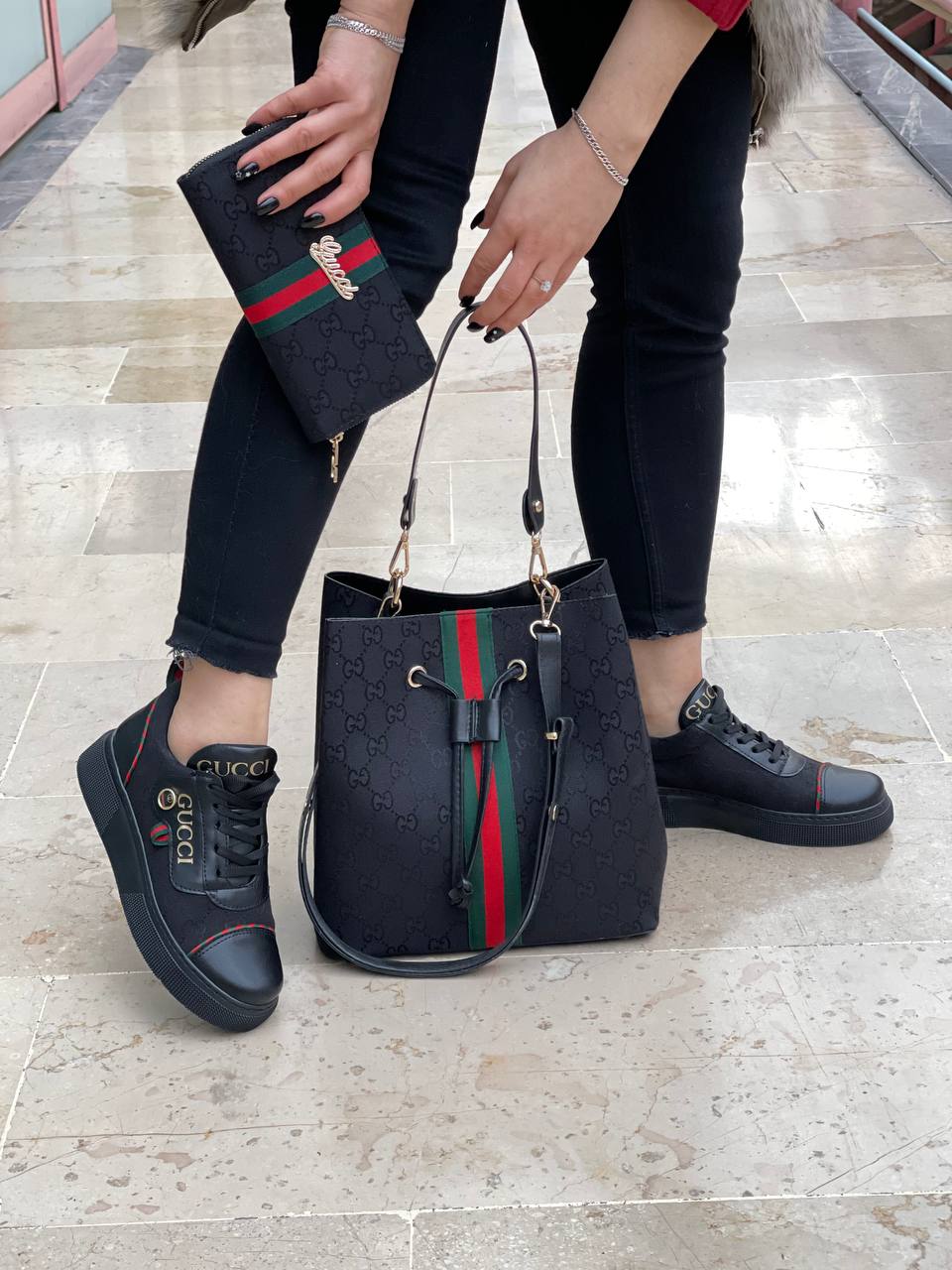 Black sneaker bag set with GG next to it