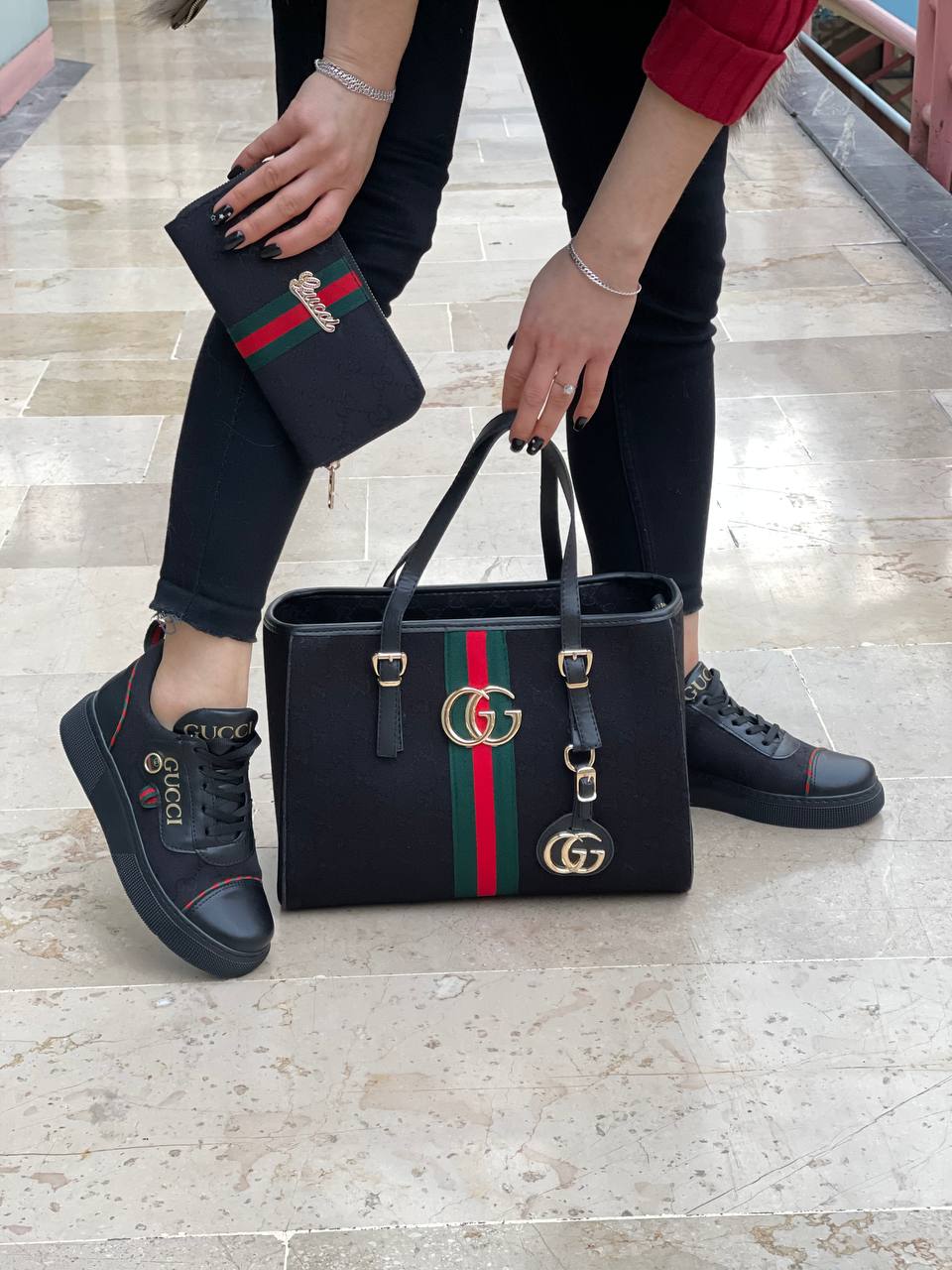 Black sneaker bag set with GG next to it