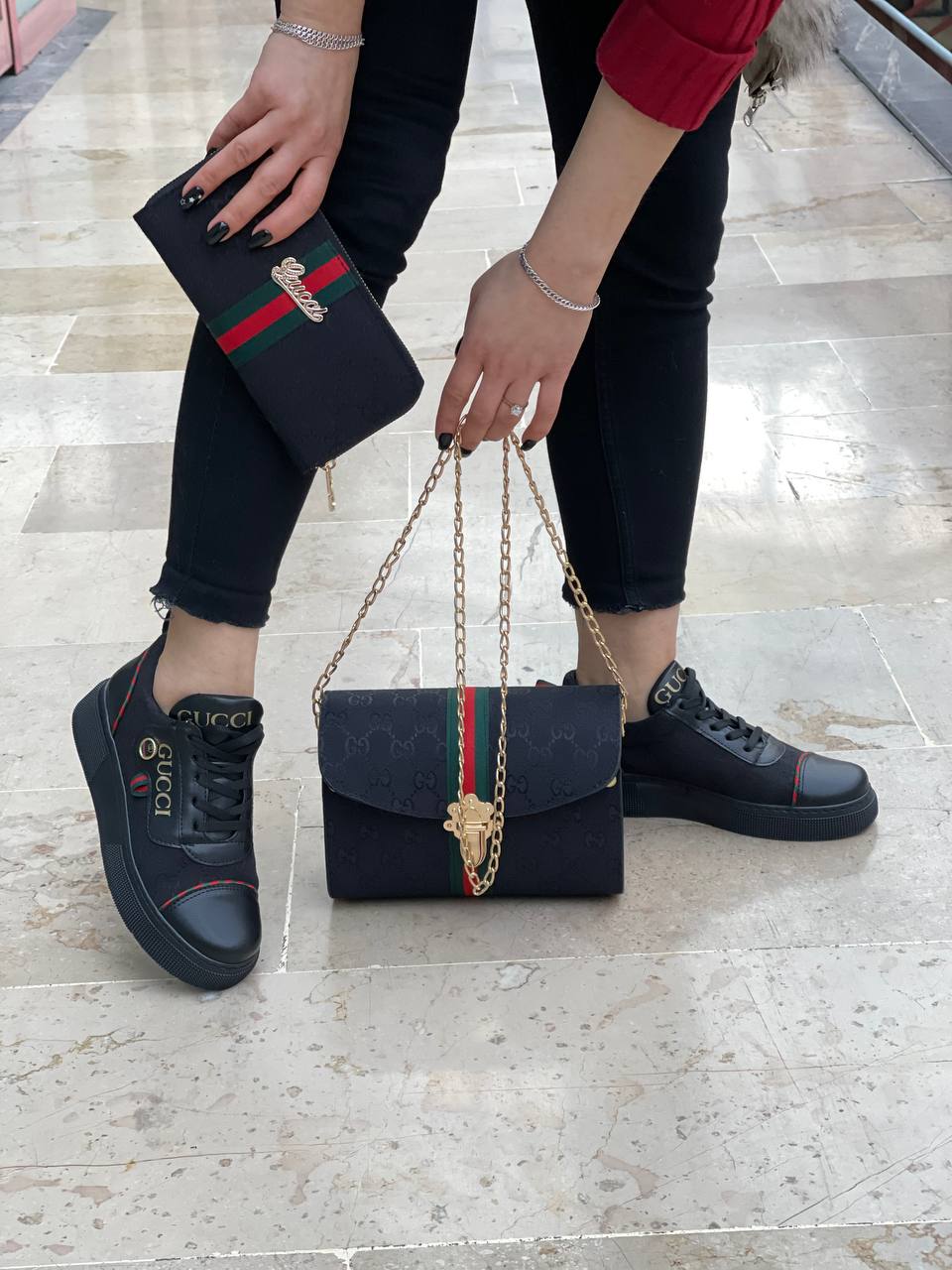 Black sneaker bag set with GG next to it