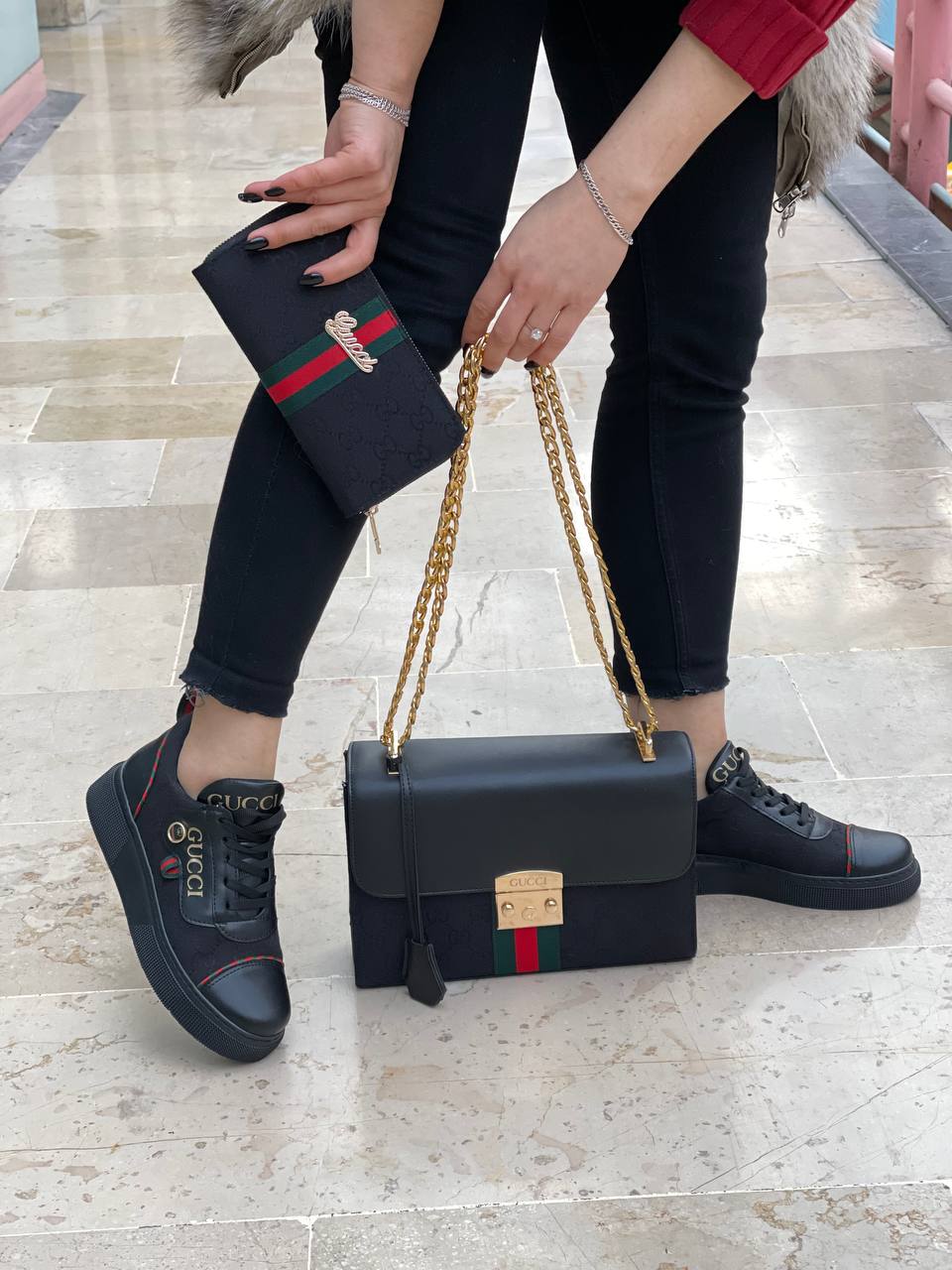 Black sneaker bag set with GG next to it