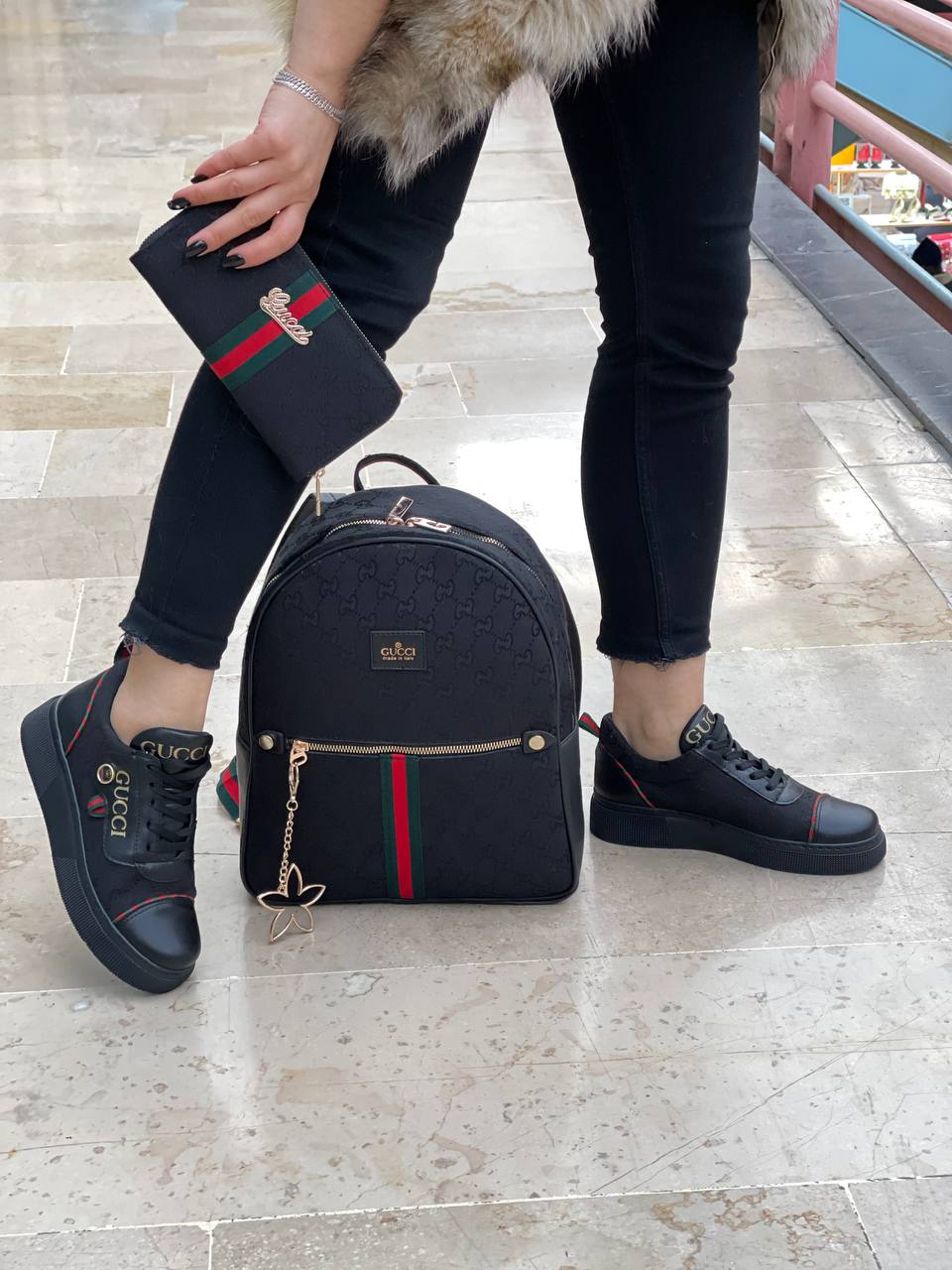 Black sneaker bag set with GG next to it