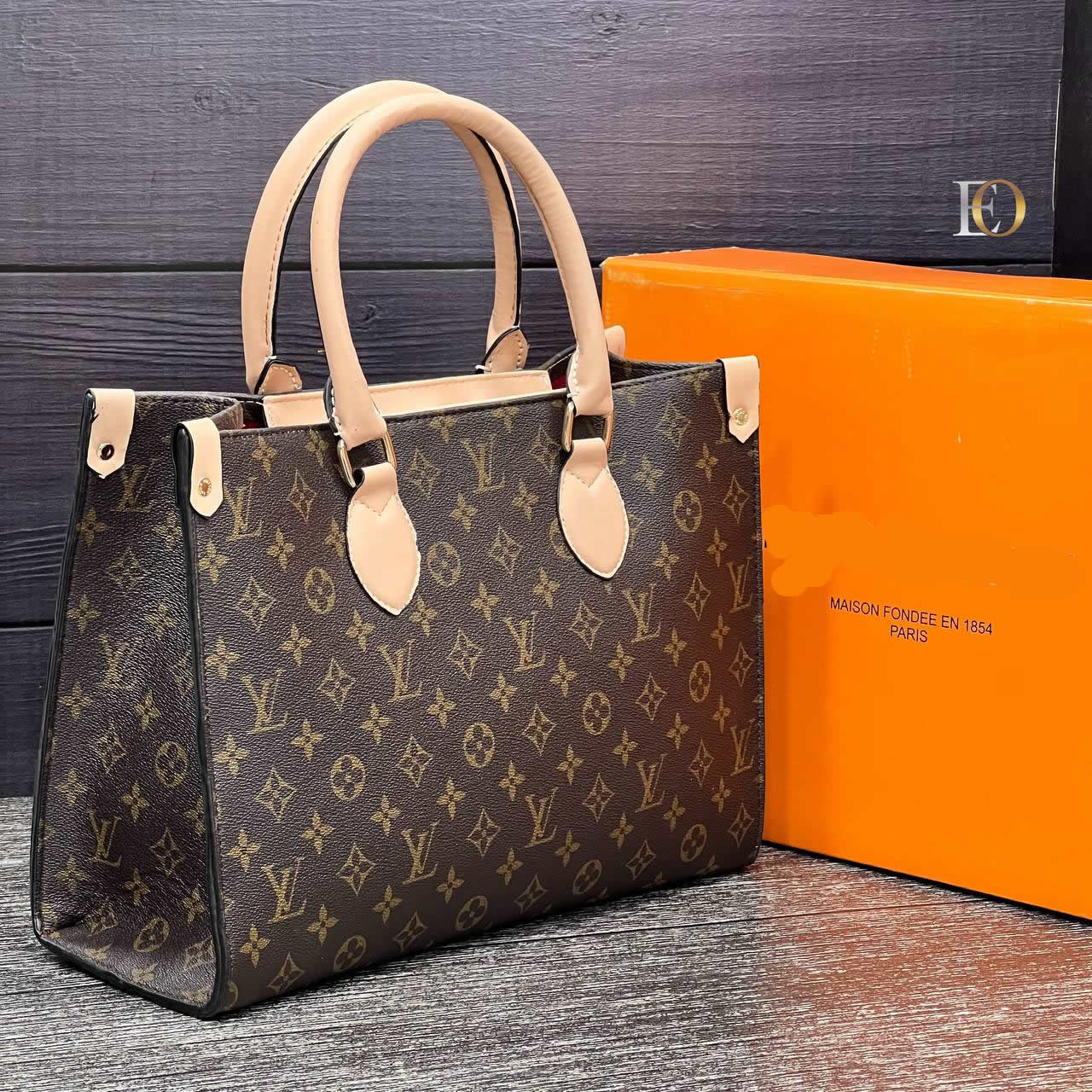 Bag model with large LV logo on it