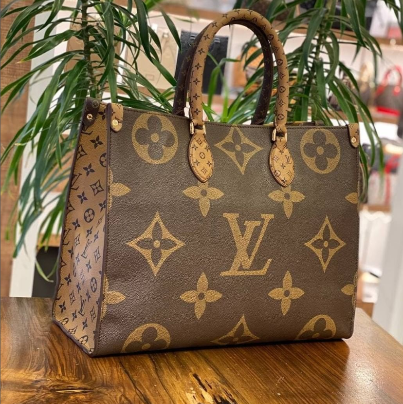 Bag model with large LV logo on it